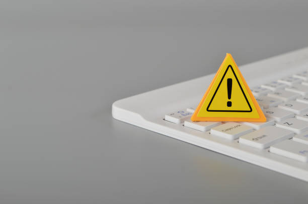 istock Computer keyboard and warning sign. Data thief, internet fraud, cyber security concept. 1443677259