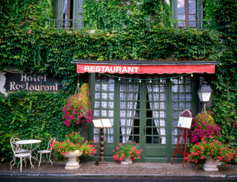 Hotel restaurant front in France,grown with ivy