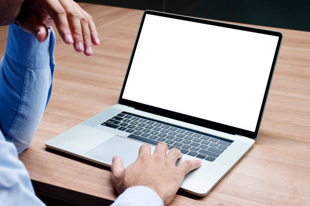 istock Businessman raise your hand with white screen background mock up on display laptop with clipping path 1443682802