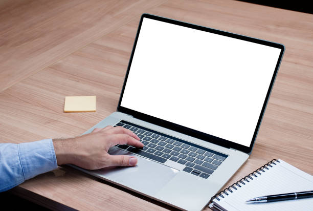 istock Businessman put your hand on keyboard and white screen background mock up on display laptop with clipping path 1443682805