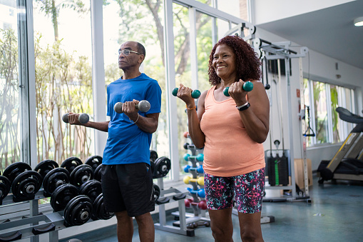 African American senior couple working out together