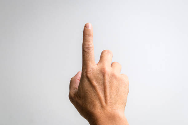 istock Male hand with index finger pointing up. 1443684144