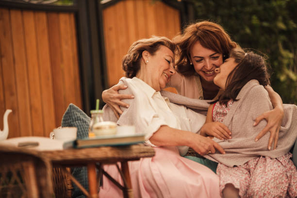 istock Affectionate hugs and smiles during cool spring day at home garden 1443686812