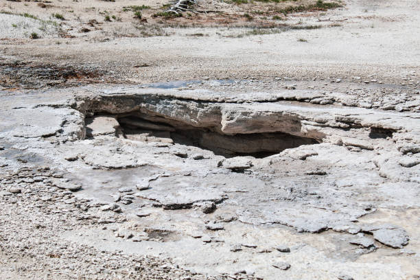 These mineral ponds filled with extremely hot waters are located all over the park in Yellowstone National Park.  The minerals in the water cause the change in colors. The heat and water come up through these cavernous areas