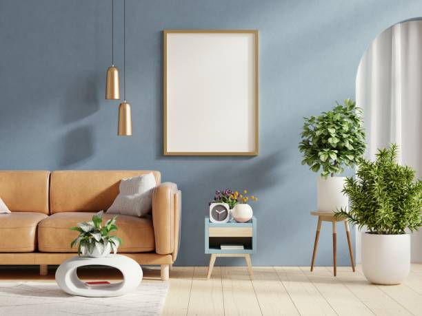 istock Mock up poster frame in in dark blue home interior with leather sofa. 1443713064