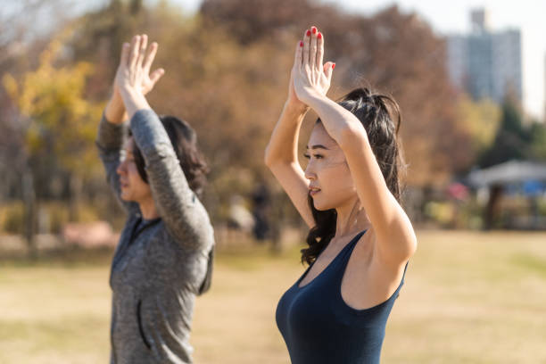 istock Asian Man and Woman Exercising 1443715238