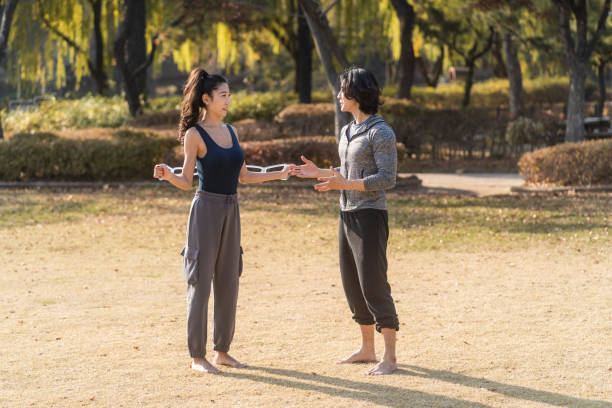 istock Asian Man and Woman Exercising 1443715350
