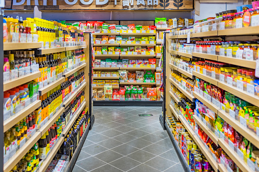 The aisles of the supermarket are lined with different sauces