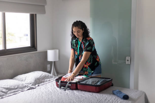 istock Latin woman packing bags 1443720646