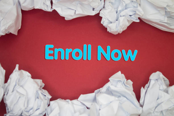 istock Enroll Now text with Torn, Crumpled White Paper on colored background. 1443727209