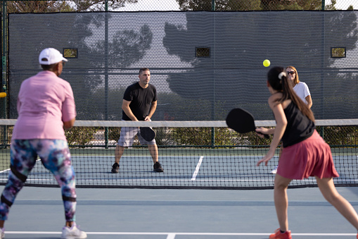 People playing pickleball on outdoor courts