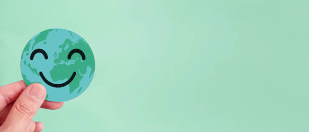 istock Hands holding earth with smile face, save planet, earth day, environment day, happy world, csr social responsibility, sustainable living concept 1443731455