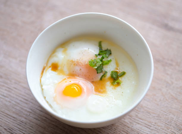 istock soft-boiled eggs on white bowl with pepper coriander on wooden table, egg breakfast, onsen egg 1443734769