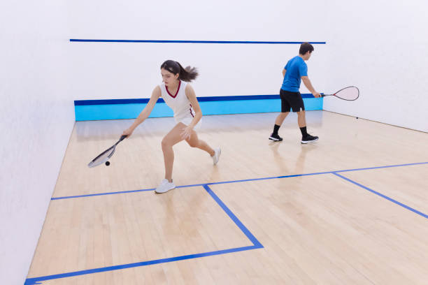 istock Young squash players in action on the court 1443735259