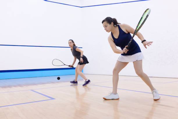 istock Squash player about to hit the ball 1443735762
