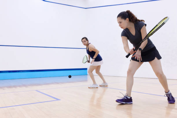 istock Squash player about to hit the ball 1443735801