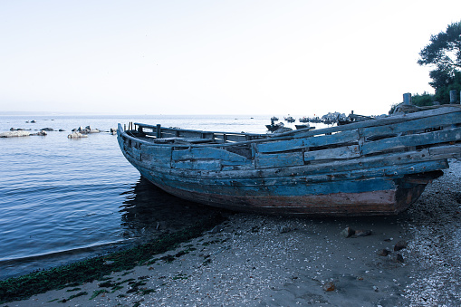 Abandoned fishing boat on the beach