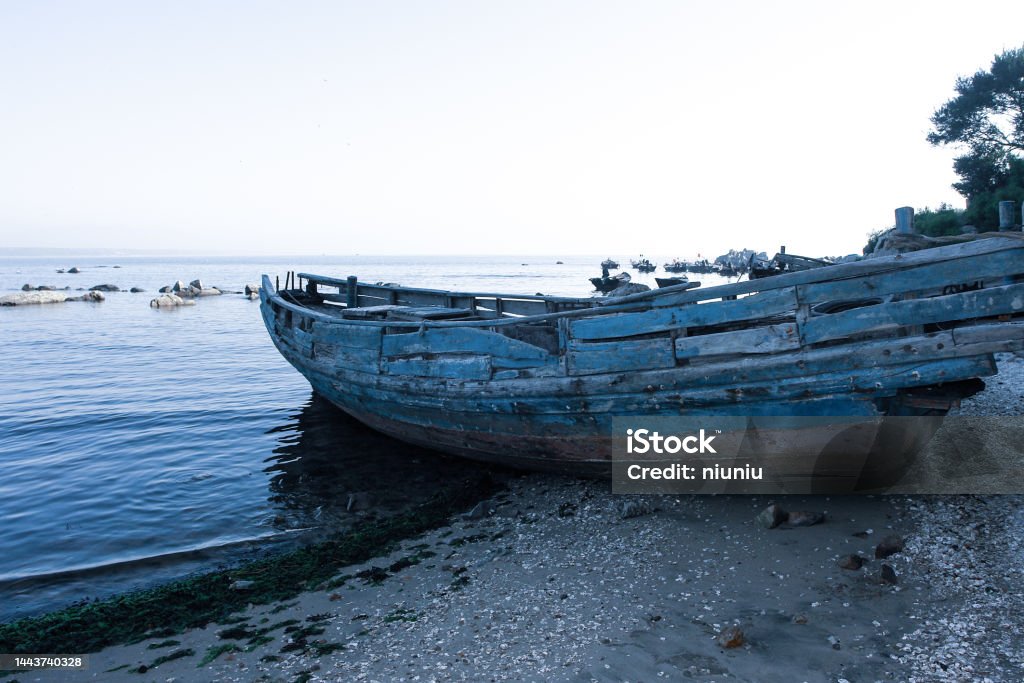 Abandoned fishing boat on the beach Abandoned Stock Photo
