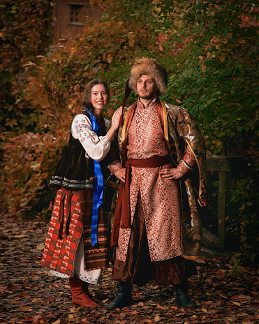 https://media.istockphoto.com/id/1443744145/photo/young-smiling-couple-dressed-traditional-ukrainian-clothing-cossack-man-and-woman-in.jpg?b=1&s=170667a&w=0&k=20&c=FVyHy_Nbv4rAadwL-JI-kHRdXfVdHRtVZQBt_l2R45k=