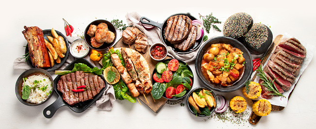 Meat dishes. Plates of various meat. Non vegetarian food banner. Top view. Panorama, banner
