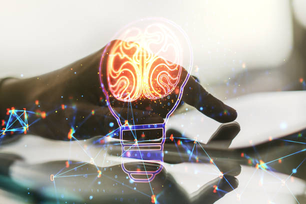 istock Creative light bulb with human brain hologram and hand working with a digital tablet on background, artificial Intelligence and neural networks concept. Multiexposure 1443754921
