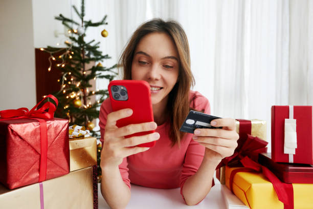istock Woman making payment online before Christmas celebration 1443758898