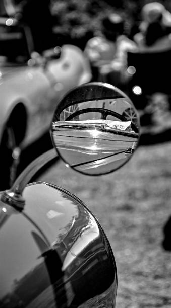 istock Vertical grayscale of a round vintage car mirror 1443758941