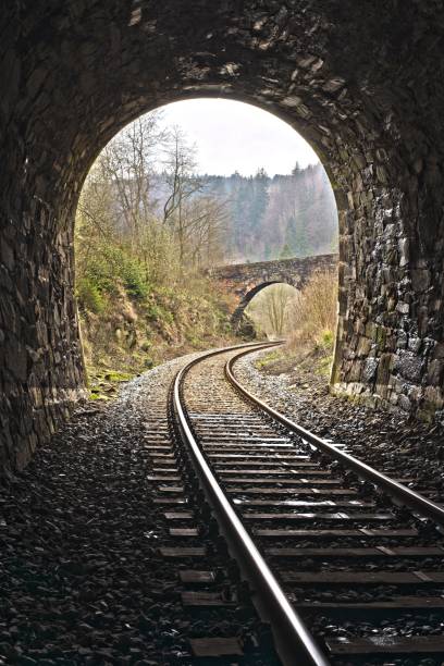 istock Exit of Vintage train stone tunnel with view on a stone bridge 1443761132