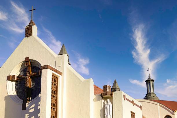 istock White small chapel against a cloudy and blue sky 1443765133