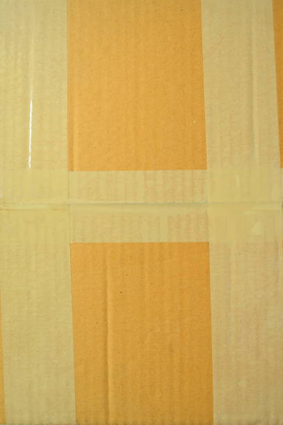 istock brown cardboard paper box, paper textured background 1443766790