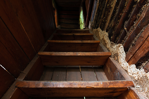 Abstract grungy interior, perspective view of an abandoned  stairway going up
