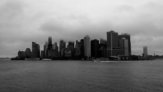 A grayscale shot of the Manhattan skyline in New York City on a gloomy day