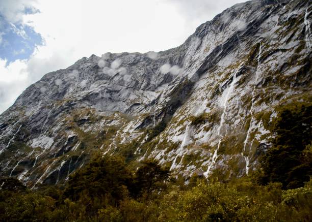 istock Scenic view of a waterfall over the rocks 1443774901