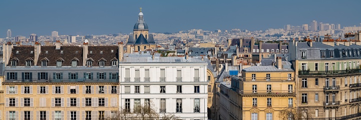 Paris, view of ile saint-louis and quai d'Orleans, beautiful buildings and quays in summer