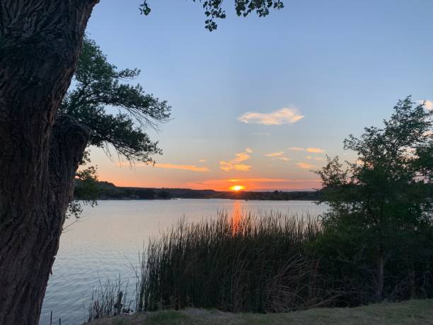 istock Tranquil lake under a sunset sky 1443778405