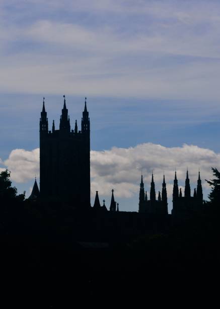 Vertical shot of the silhouette of Merchant logo Canterbury Cathedral in Canterbury, England A vertical shot of the silhouette of Merchant logo Canterbury Cathedral in Canterbury, England canterbury england stock pictures, royalty-free photos & images