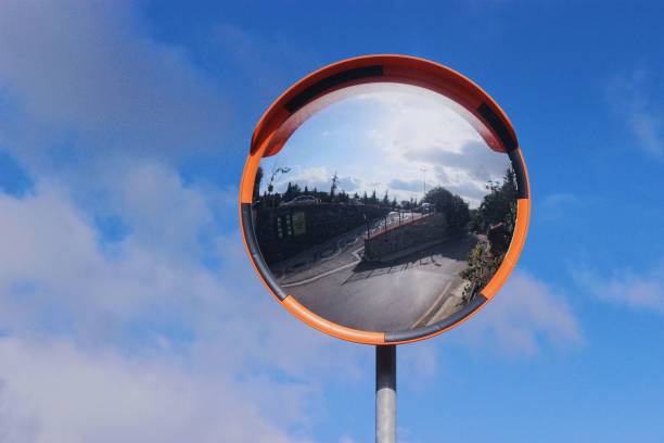 istock Road mirror against the cloudy sky 1443780964