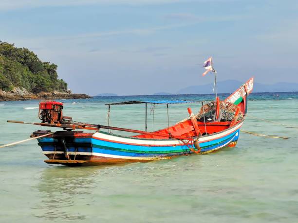 istock Red and blue longtail boat on an island, Thailand 1443781888