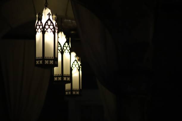 istock Three decorative hanging lanterns in the dark room 1443784209