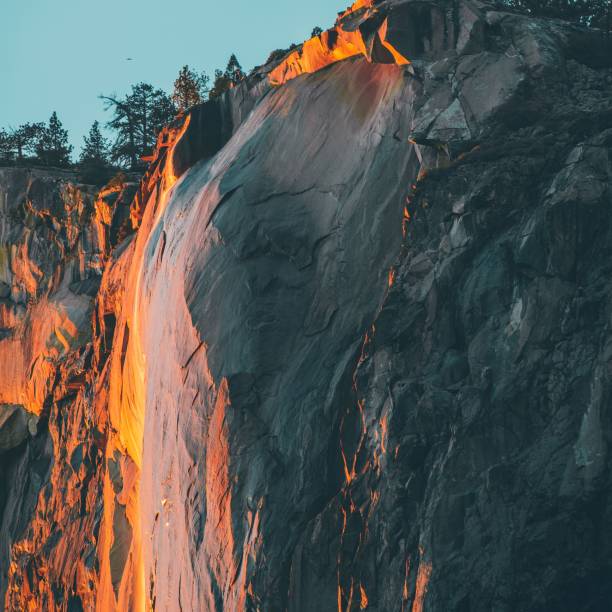 istock Breathtaking view of high rock cliffs under orange sunset light 1443784501