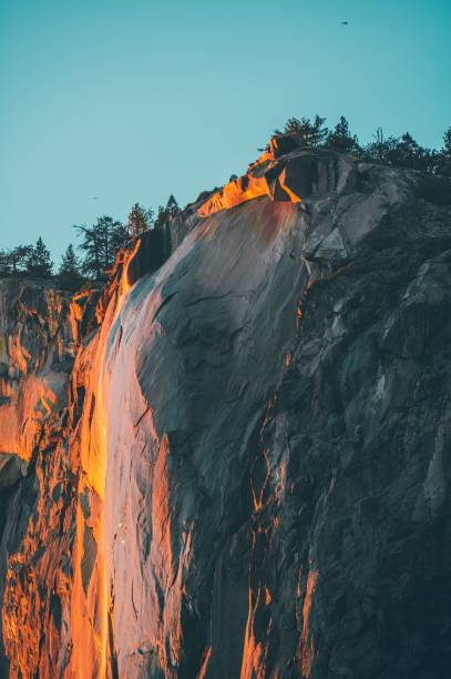 istock Breathtaking view of high rock cliffs under orange sunset light 1443784507