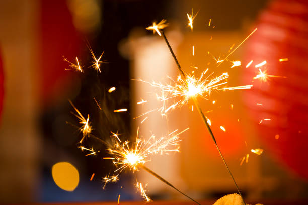 Two burning fireworks sticks, Chinese New Year festive atmosphere background stock photo