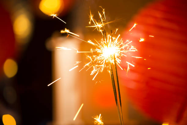 istock Three burning fireworks sticks, Chinese New Year festive atmosphere background 1443784975