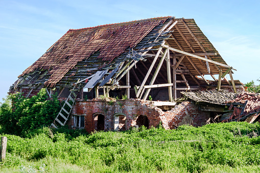 Apartment under the roof of a red brick townhouse destroyed by fire.