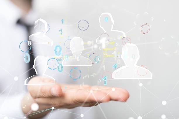 istock 3D rendering of networking human icons floating in air with hand underneath. 1443789489
