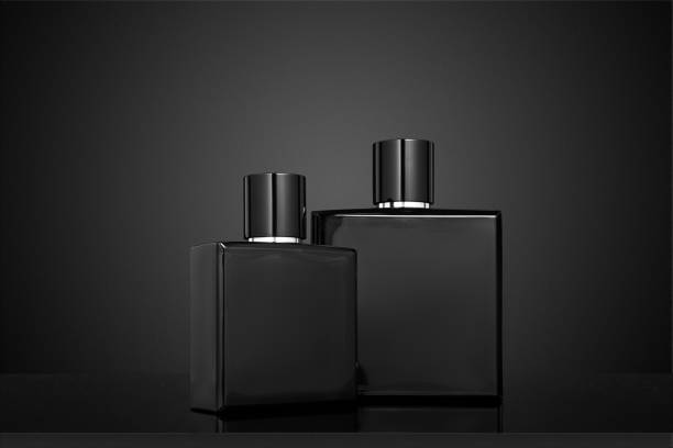 istock Two Black perfume bottles on a black background. 1443791054