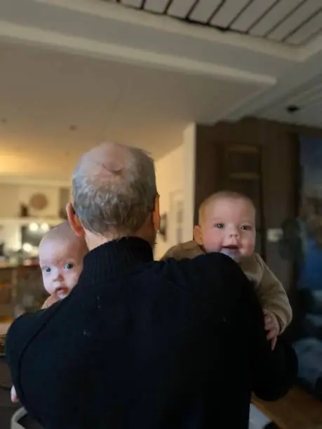 Photo of Grandfather with his twins grandchildren
