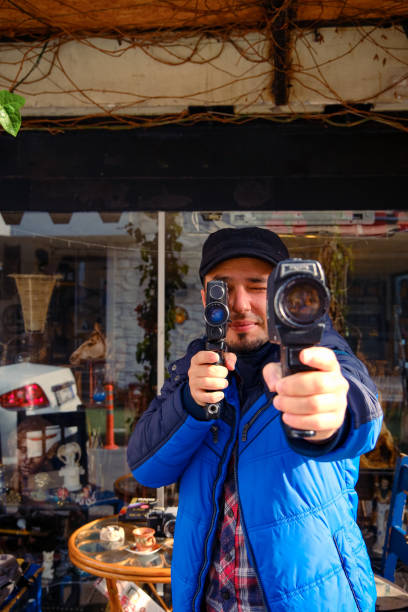 Vintage photo camera in the hands of man, soft focus