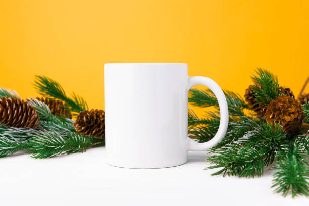 istock White ceramic mug with copy space with Christmas tree, front view. Mockup for applying a logo, drawing for the holiday. 1443800965