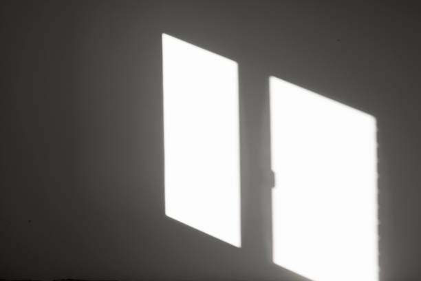 istock Abstract background with reflection of sunlight from a window in an empty room on a gray wall. Beautiful diagonal lines in reflection. 1443801632